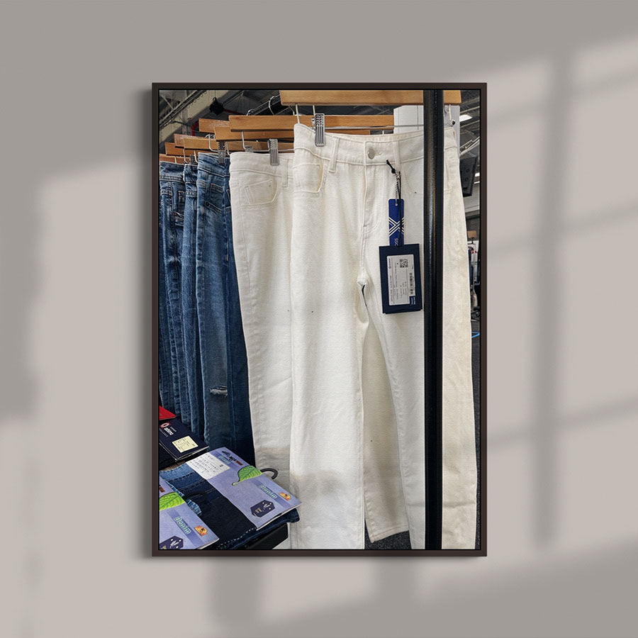 denim trousers on hanger on trade show