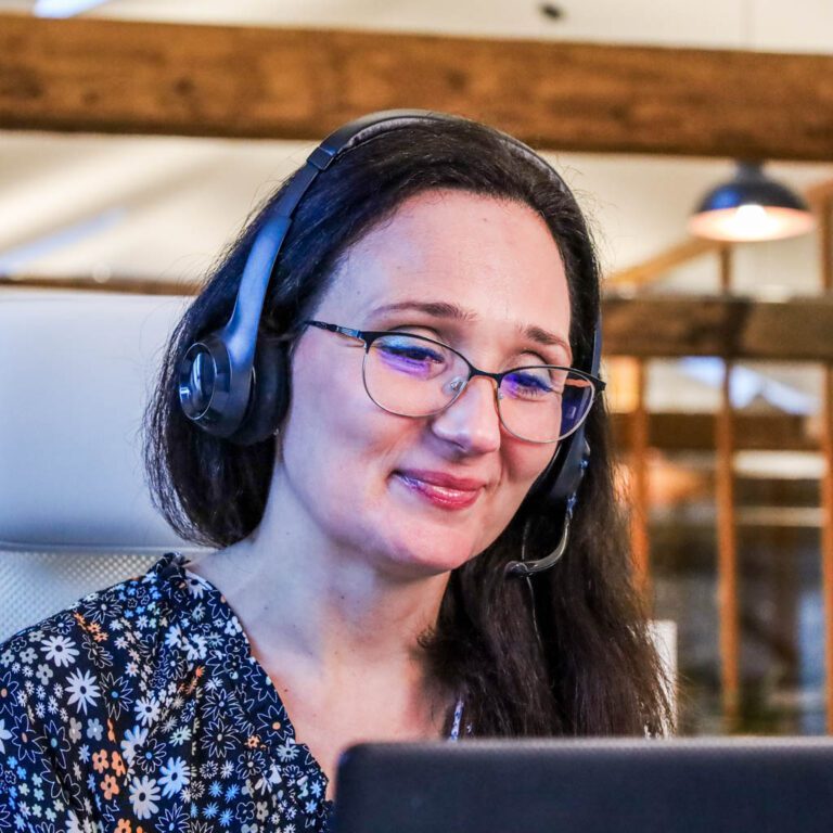 Material Exchange employee with headset talking with client