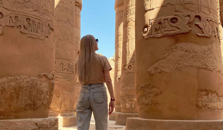 woman exploring ancient Egyptian ruins